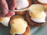 Poached Eggs & Satsuma Hollandaise over Crab Cakes