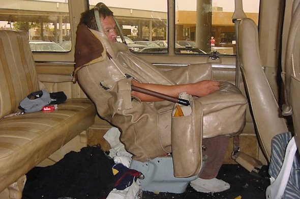 US border control release photo of man sewn into car seat