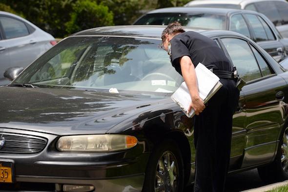 Traffic warden tickets car with dead man inside