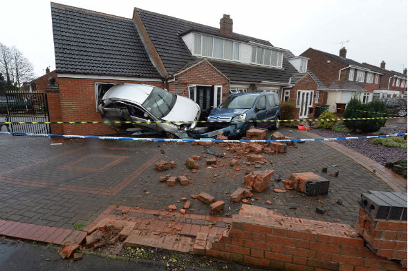 Ford Focus crashes backwards into pensioner's kitchen