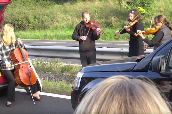 Music to our ears: String quartet serenades motorists on gridlocked M5