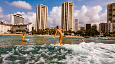 Surfing at Kuhio Beach