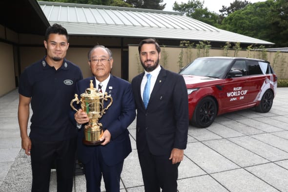KYOTO, JAPAN - MAY 10:  (L-R) Yu Tamura of Japan, Fujio Mitarai, Chairman of the RWC 2019 Organising Committee and Agustin Pichot, Vice-Chairman of World Rugby pose with The William Webb Ellis Cup during the Rugby World Cup 2019 Pool Draw at the Kyoto State Guest House on May 10, 2017 in Kyoto, Japan.  (Photo by Dave Rogers - World Rugby/World Rugby via Getty Images)