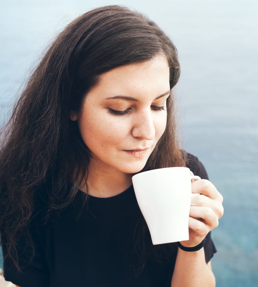 Young woman enjoying tea