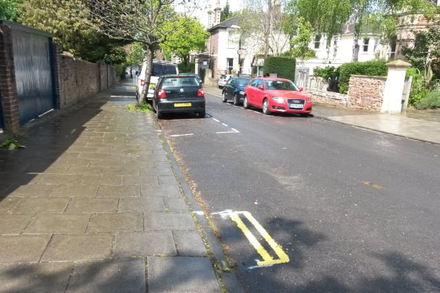 A set of double yellow lines on Leigh Road in Bristol as a council has defended painting the set of double yellow lines measuring less than a metre long on a residential street. PRESS ASSOCIATION Photo. Picture date: Tuesday May 5, 2015. Elected mayor George Ferguson introduced the controversial plans to combat parking problems in parts of the city. Residents have poked fun at the lines - which are more than 50cm shorter than the front of a Smart car - on social media. See PA story SOCIAL Lines. Photo credit should read: Claire Hayhurst/PA Wire