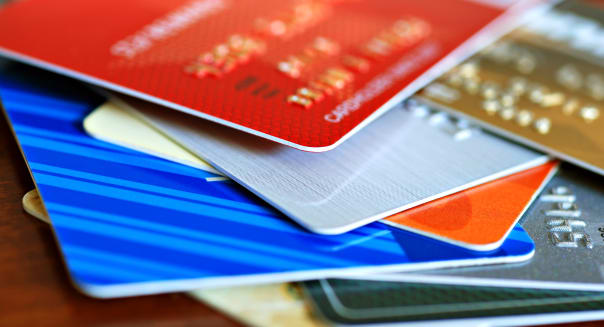Colorful stack of credit cards and shopping gift cards.  Macro with extremely shallow dof.