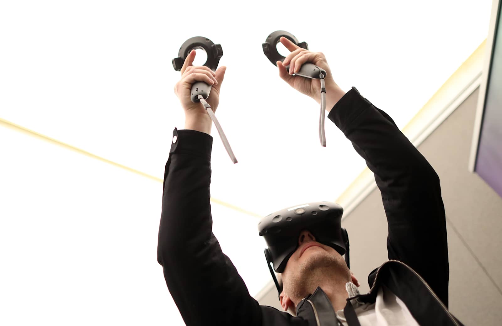 an-attendee-holds-virtual-control-sticks-whilst-wearing-a-htc-corp-picture-id667640838