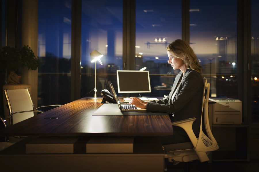 Mature Business Woman Working Late