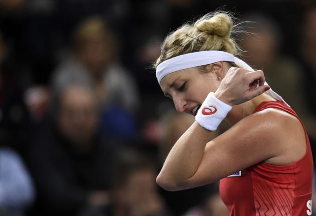 Swiss player Timea Bacsinszky gestures during the Fed Cup first round between Switzerland and France in Geneve on February 11, 2017.   / AFP PHOTO / JEAN-PHILIPPE KSIAZEK