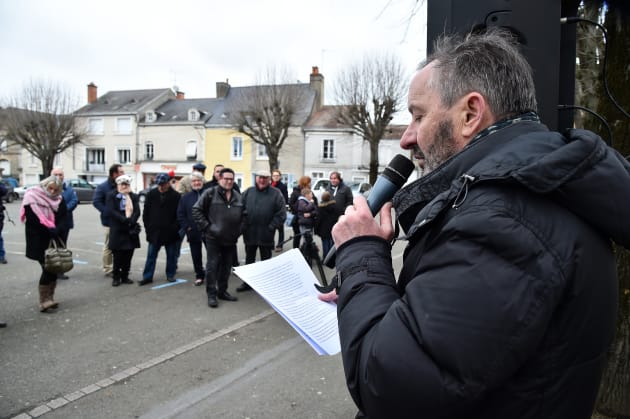 Didier Hutin, insurance agent, President of the Cyclist Club and organiser of a citizens' gathering to ask Franï¿½ois Fillon to renounce his candidacy for the Presidency of the Republic, addresses a message to demonstrators who came to express their discouragement, after the revelations by The "Canard Enchaine" of the supposedly fictional jobs of Penelope Fillon on February 11, 2017, in Sable-sur-Sarthe, northwestern France. Winner of the right-wing primaries ahead of France's 2017 presidential elections, Franï¿½ois Fillon was elected mayor, councillor general, deputy, in Sable-Sur-Sarthe, after the death of Joel Le Theule. / AFP PHOTO / JEAN-FRANCOIS MONIER