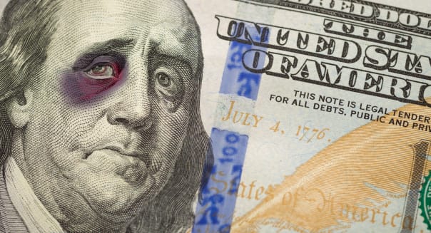 Bruised, Battered and Black Eyed Ben Franklin on the Newly Designed United States One Hundred Dollar Bill.