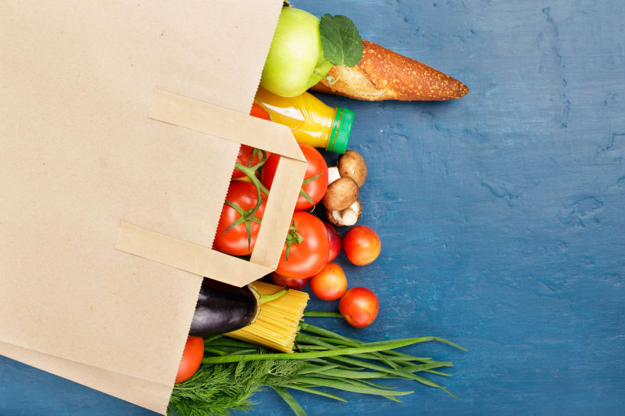 Paper bag with different of vegetables and fruits