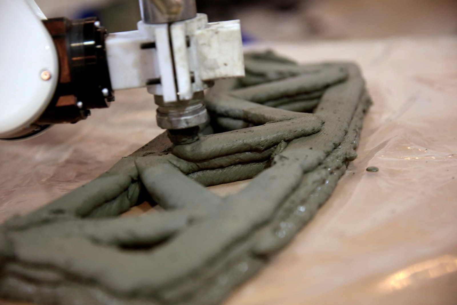 photo of A 3D-printed bridge is being built using reinforced concrete image