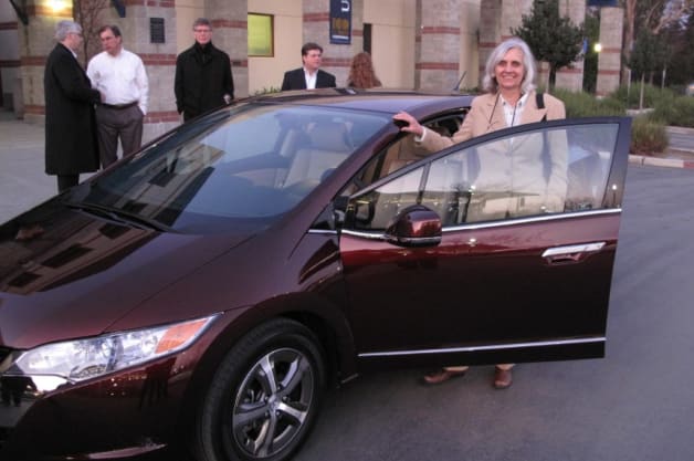 Joan Ogden, director of the Next Sustainable Transportation Pathways (NextSTEPS) program at the UC Davis Institute of Transportation Studies stands beside a hydrogen fuel cell vehicle, a Honda FCX Clarity.