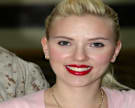Scarlett Johansson smiles after being pinned with gunnery sergeant rank during a meet and greet Jan. 20 in the United Service Organizations building at Camp Buehring, Kuwait.