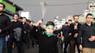An Iranian boy uses chains Saturday to flagellate himself as he takes part in a religious event to mark Ashura in Tehran.