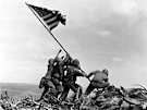 Photographer Joe Rosenthal admitted he staged one photo at Iwo Jima during a radio interview. But a Time reporter assumed he was talking about the memorable flag planting image.