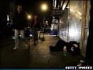 Young man lying in a street