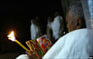 A Ethiopian worshipper with a candle
