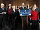 Senate Majority Leader of Harry Reid, D-Nev., center, accompanied by Senate Democrats, speaks during a health care news conference on Capitol Hill in Washington, Dec. 23, 2009.