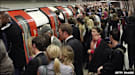 Crowds queue to get on an Underground train