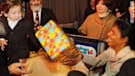 Moshe Holtzman celebrates his third birthday with nanny Sandra Samuel.