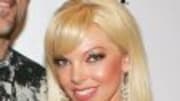  BUENA PARK, Calif. &mdash; A reality TV contestant was charged with murder Thursday in the death of his ex-wife as the manhunt for the suspect spread to Canada and polic...