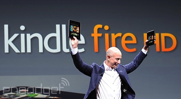 Amazon CEO Jeff Bezos stands victorious with Kindle Fires