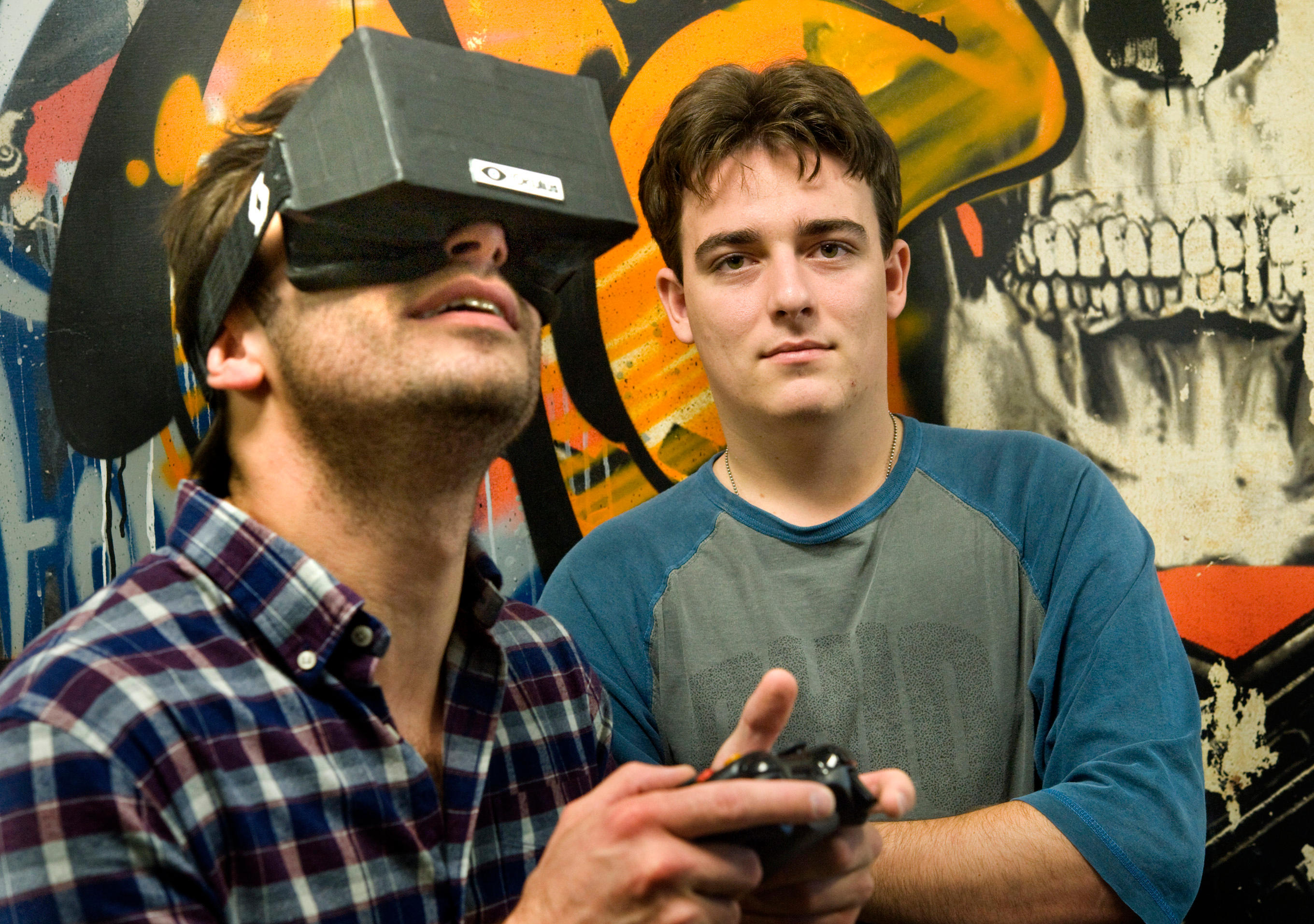 Nov. 14, 2011 - Irvine, California, U.S. - Oculus VR founder Palmer Luckey, 20, right, is the inventor of a virtual reality gami