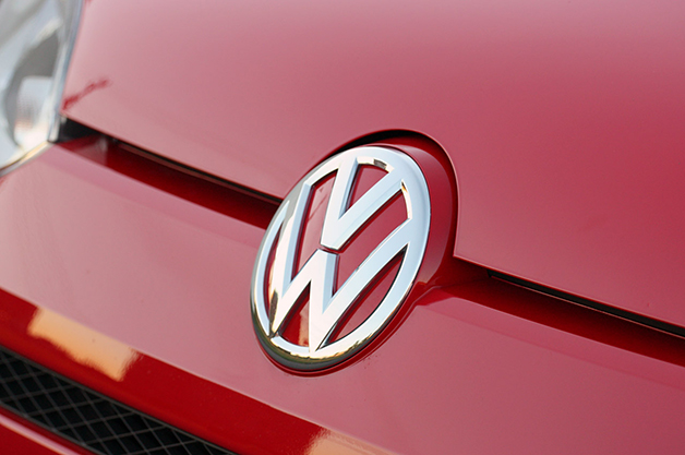 The Volkswagen badge on a 2013 VW Up