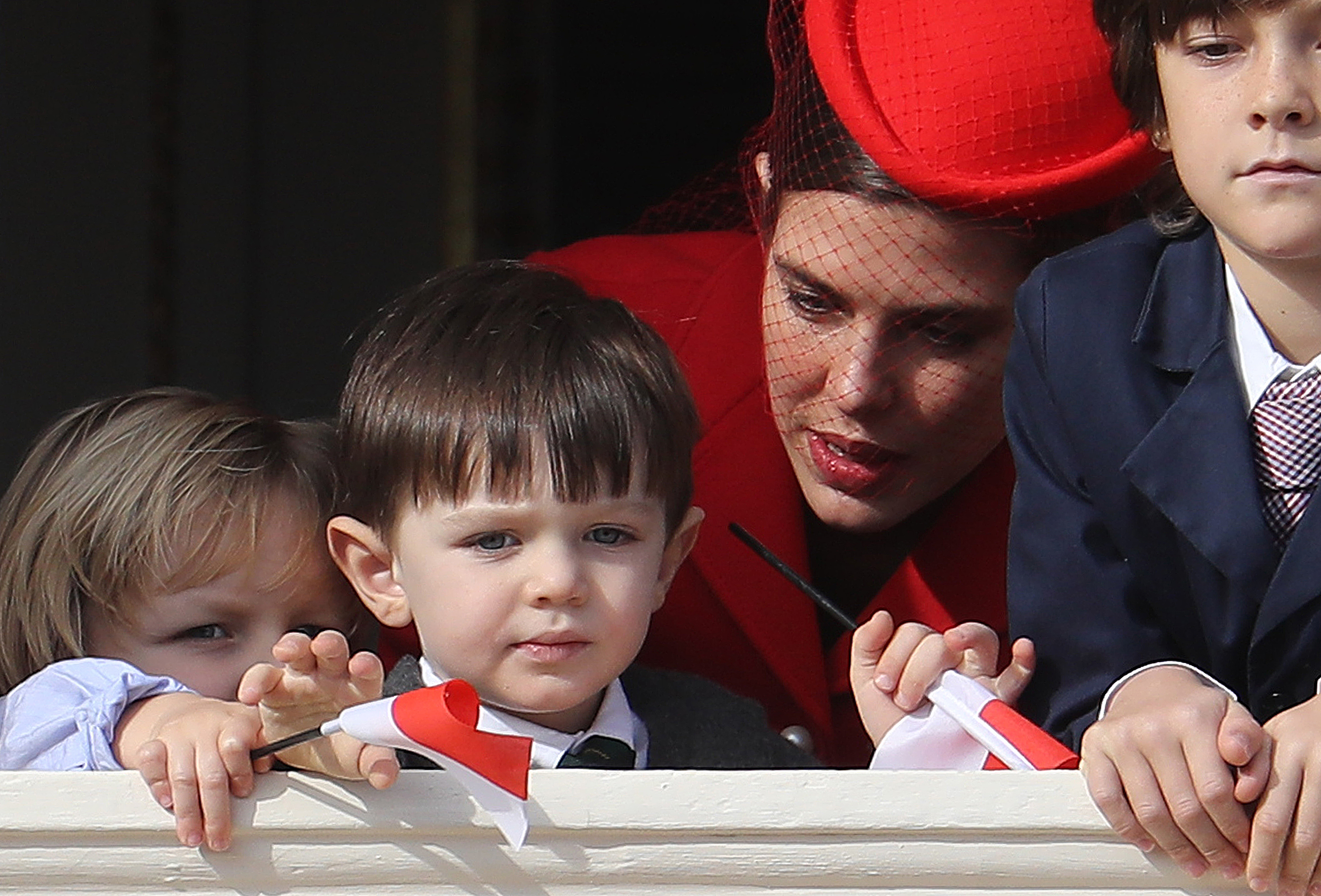 Monaco's Princess Charlotte Casiraghi (2ndR) and her son Raphael (2ndL) appear on the balcony of the Monaco Palace during the celebrations marking Monaco's National Day, on November 19, 2016 in Monaco.   / AFP PHOTO / VALERY HACHE