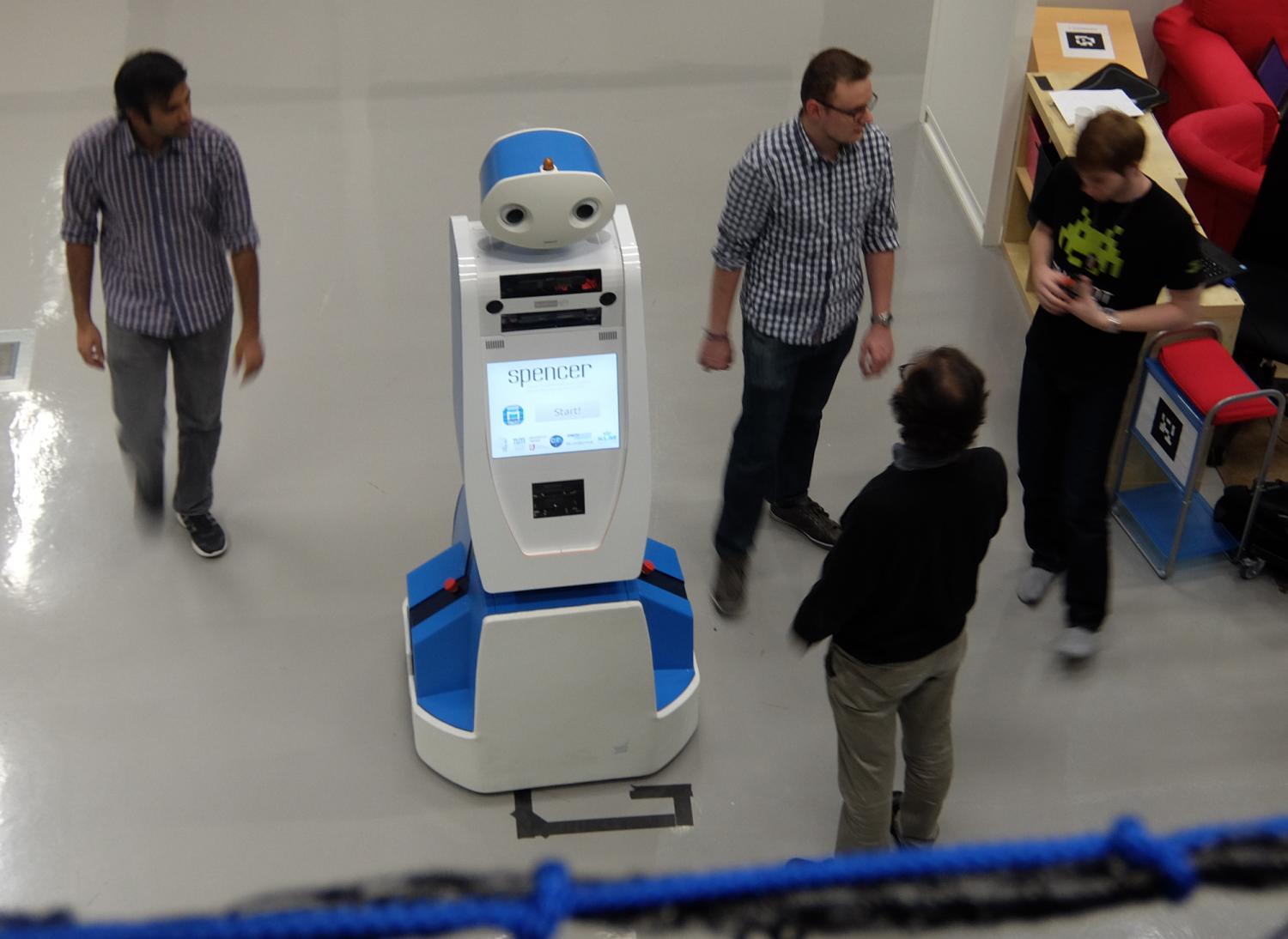 photo of 'Spencer' the robot is here to help guide lost airline passengers image