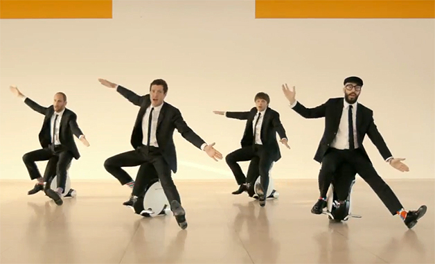 photo of Video: OK Go ride Honda UNI-CUB β in latest amazeballs music video image