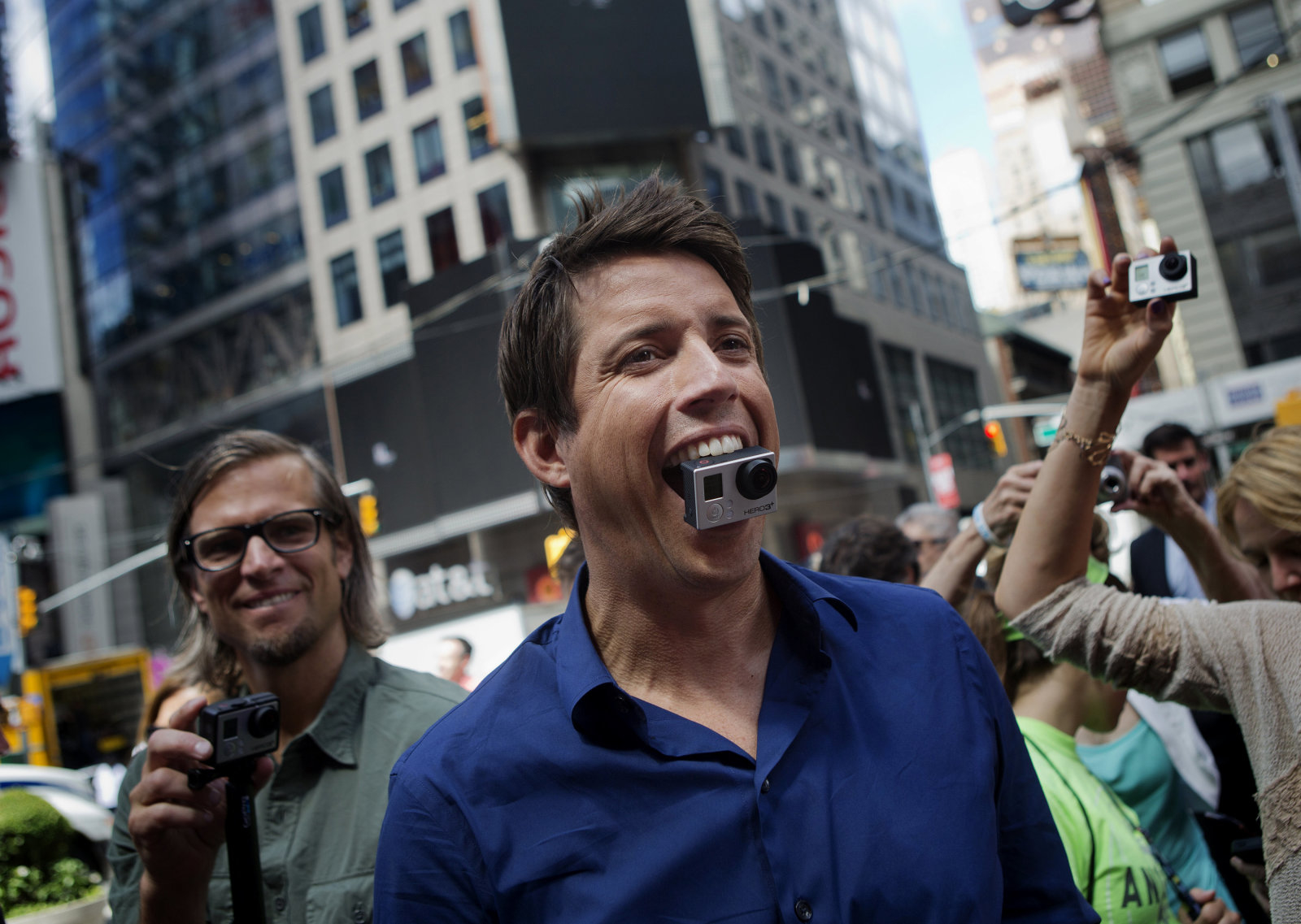 Bloomberg's Best Photos 2014: Nick Woodman, founder and chief executive officer of GoPro Inc., stands for a photograph with a GoPro Hero 3+ camera in his mouth after ringing the opening bell for the release of the company's IPO at the Nasdaq MarketSite in New York, U.S., on Thursday, June 26, 2014. GoPro Inc., whose cameras let surfers, skiers and sky divers record their exploits, rose in its trading debut after pricing its initial public offering at the top of the marketed range. Photographer: Victor J. Blue/Bloomberg via Getty Images 