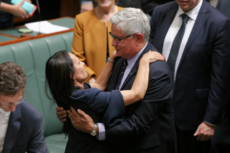 Liberal MP Ken Wyatt embraces Linda Burney, first Aboriginal woman in the House of Representatives, after she delivered her first speech