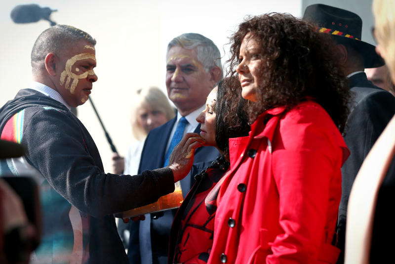 Ken Wyatt, Linda Burney and Malarndirri McCarthy during the smoking ceremony at the welcome to country ceremony on the forecourt to mark the opening of the 45th Parliament,