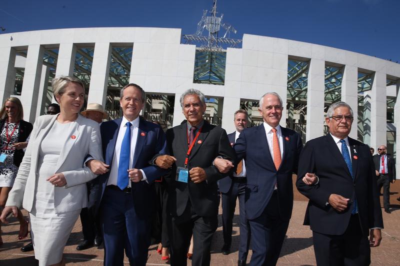 Prime Minister Malcolm Turnbull and Opposition Leader Bill Shorten came together to link arms with Charlie King, Tanya Plibersek and Ken Wyatt at the No More event in support of ending family violence