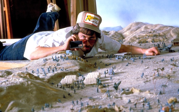 Director Steven Spielberg on a miniature set for RAIDERS OF THE LOST ARK, 1981, (c) Paramount/courtesy Everett Collection