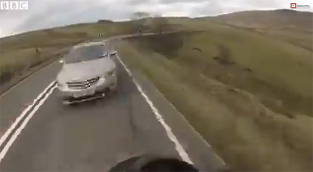 Screencap from an English motorcyclists' helmet cam just before he takes a 40-foot fall.