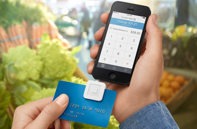 Taking a payment on a Square Reader attached to an iPhone
