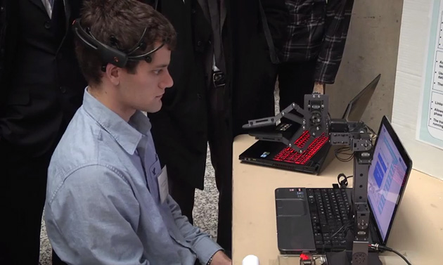 Ryan Mintz shows a mind-controlled robot arm