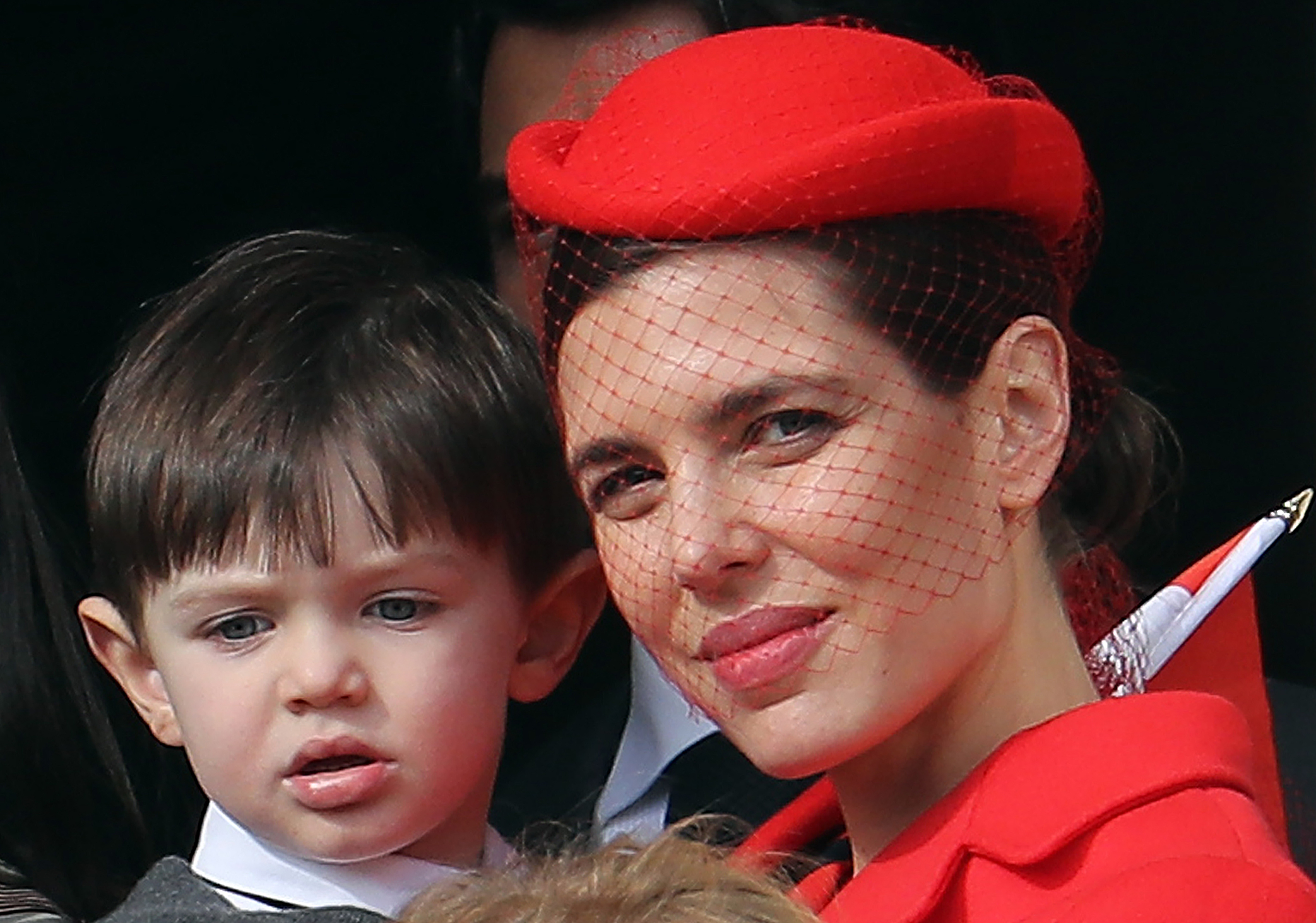 Monaco's Princess Charlotte Casiraghi (R) and her son Raphael appear on the balcony of the Monaco Palace during the celebrations marking Monaco's National Day, on November 19, 2016 in Monaco.   / AFP PHOTO / VALERY HACHE