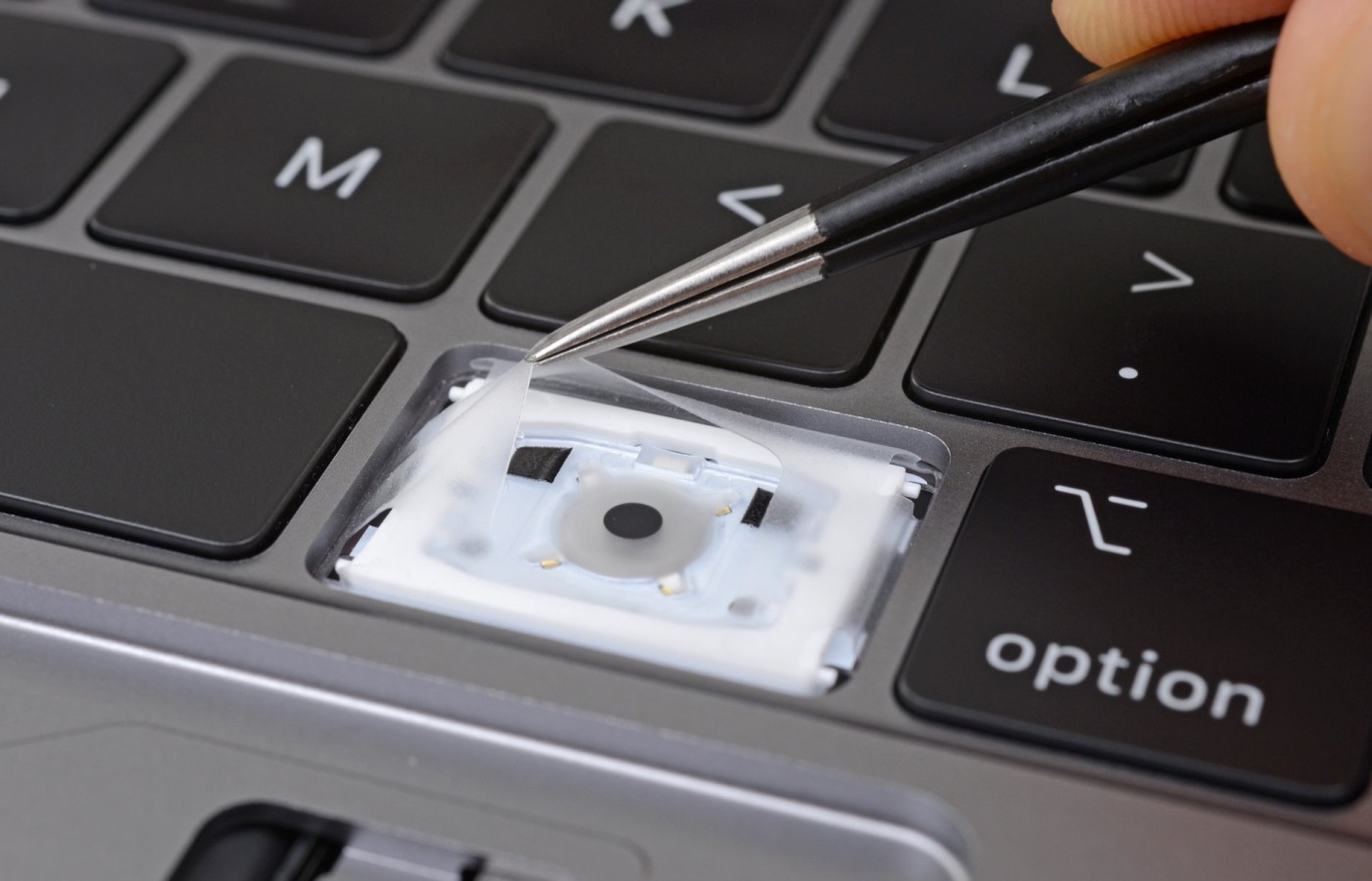 photo of iFixit finds a 'cover-up' inside new MacBook Pro keyboards image