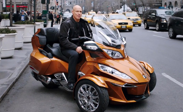 Ex-NHL player Mark Messier sits on a Can-Am Spyder in a commercial for the Mark Messier Guarantee