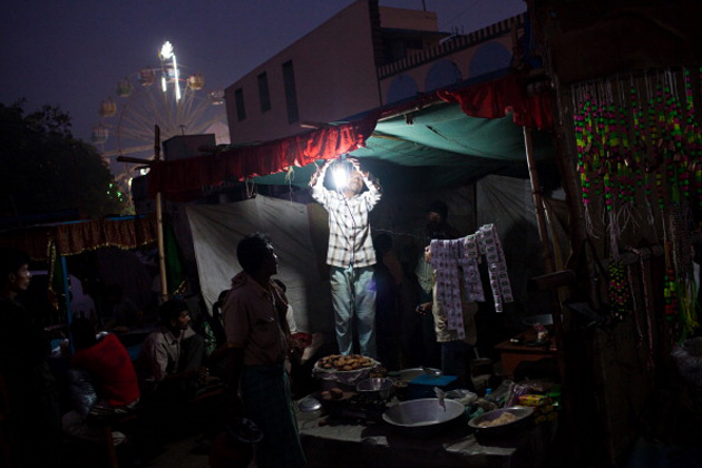 An Indian street vendor gets a light bulb going