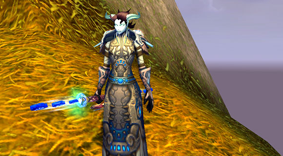 A draenei mage wielding the Apostle of Argus staff