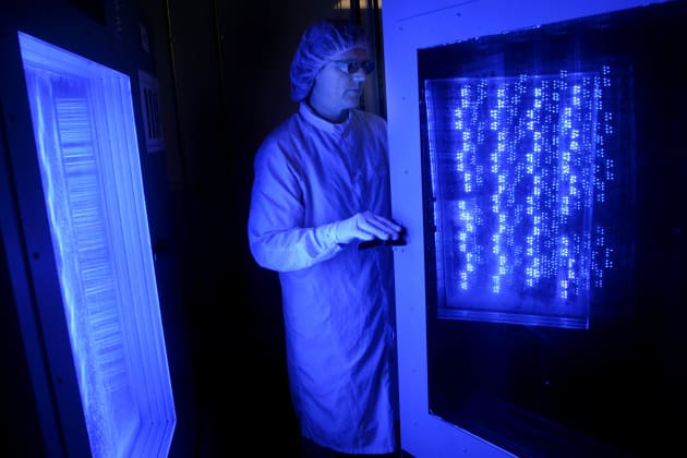 Ted Lowes tests blue light-emitting diodes (LEDs) at a Cree