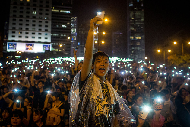 Hong Kong protesters light up their phones in solidarity
