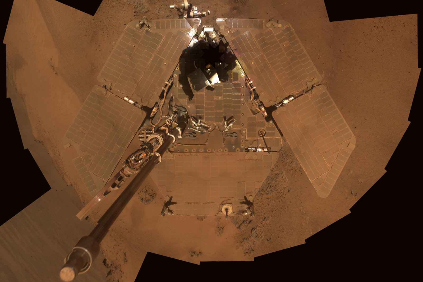 NASA handout image shows a self portrait from the Mars Exploration Rover Opportunity covered in dust as the mission approached its fifth Martian winter, December 21 to 24, 2011. This is a mosaic of images taken by Opportunity's panoramic camera (Pancam) during the 2,111th to 2,814th Martian days, or sols. The downward-looking view omits the mast on which the camera is mounted. REUTERS/NASA/JPL-Caltech/Cornell/Arizona State University/Handout (SCIENCE TECHNOLOGY ENVIRONMENT) FOR EDITORIAL USE ONLY. NOT FOR SALE FOR MARKETING OR ADVERTISING CAMPAIGNS. THIS IMAGE HAS BEEN SUPPLIED BY A THIRD PARTY. IT IS DISTRIBUTED, EXACTLY AS RECEIVED BY REUTERS, AS A SERVICE TO CLIENTS