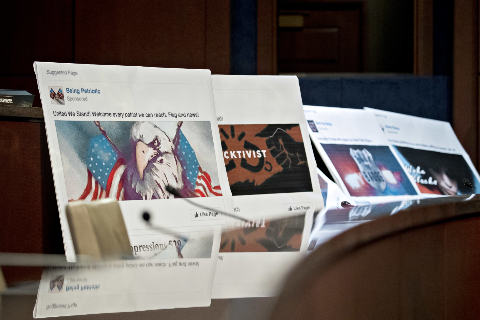 Displays showing social media posts are seen during a House Intelligence Committee hearing in Washington, D.C., U.S., on Wednesday, Nov. 1, 2017. The top Democrat on the Senate Intelligence Committee berated lawyers today for social media giants Facebook, Twitter and Google for a lethargic response to Russian interference in U.S. politics, as the companies' lawyers faced a second day of grilling in Congress. Photographer: Andrew Harrer/Bloomberg via Getty Images
